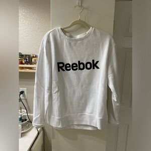"Reebok white sweater."